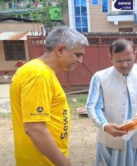 Srikanth Gundvarapu with a relief volunteer in Nepal